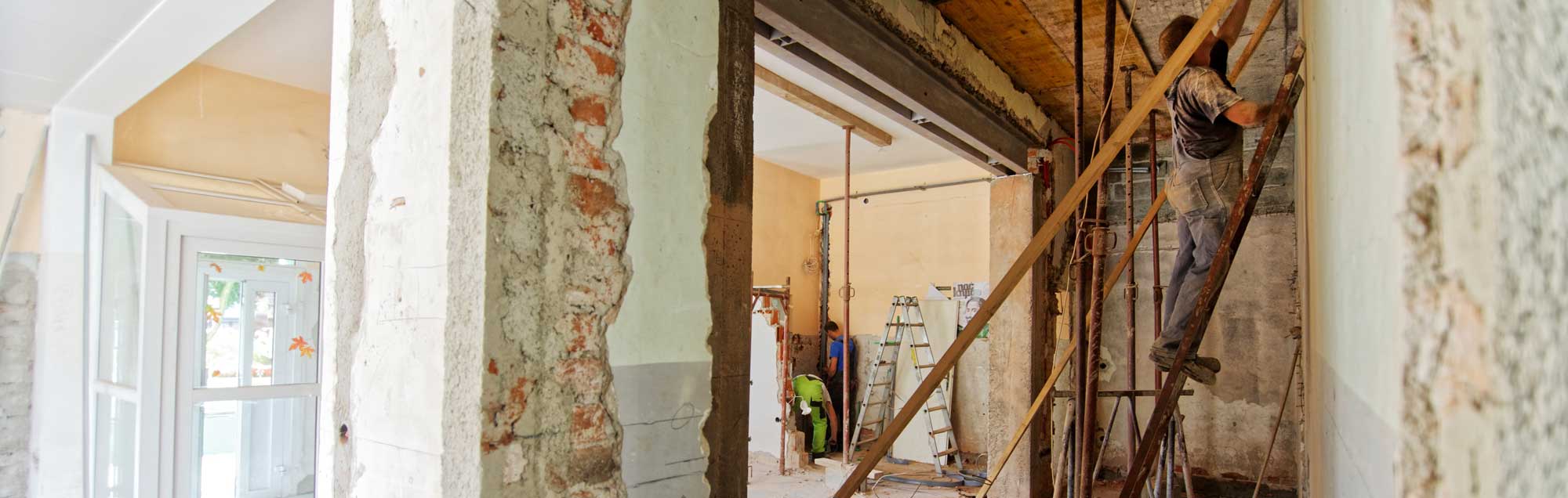 People repairing house damage